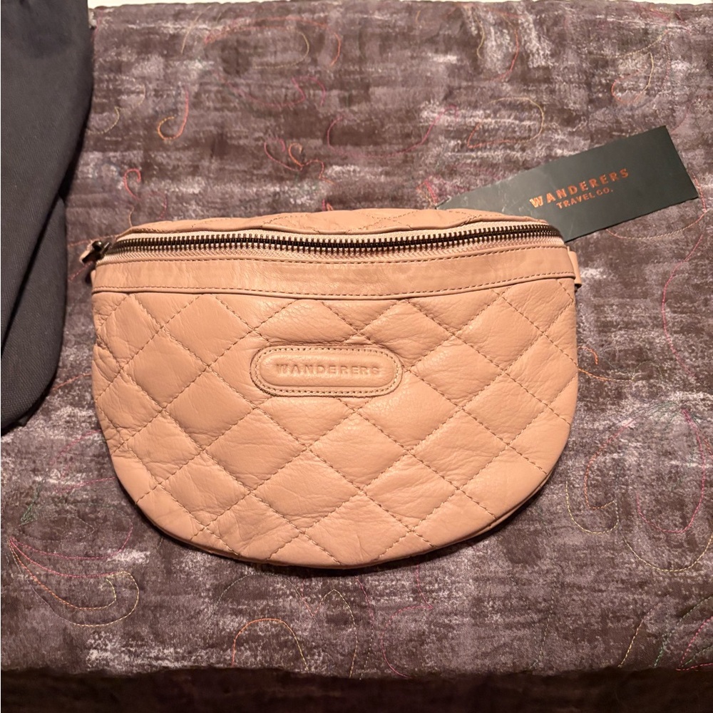 Wander Fanny pack or sling bag in nice neutral tan comes with small wallet. NEW
